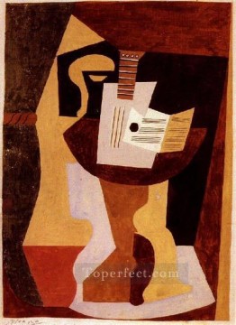 Artworks by 350 Famous Artists Painting - Guitar and score on a pedestal table 1920 Pablo Picasso